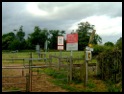 The Railway Crossing with a variety of signs .