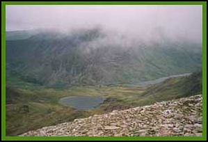  Pen yr Ole Wen shrouded in mist, with Llyn Idwel, and Llyn Ogwen to its right.
