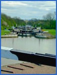 Looking down the Hatton flight' of locks. Noote St Mary's Chuch in Warwick can be seen in the distaance .