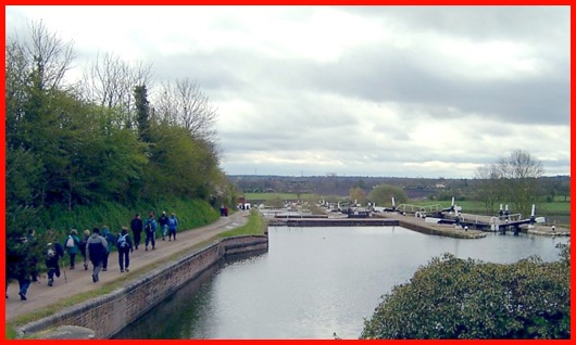 Walking alongside the flight of locks at Knowle .