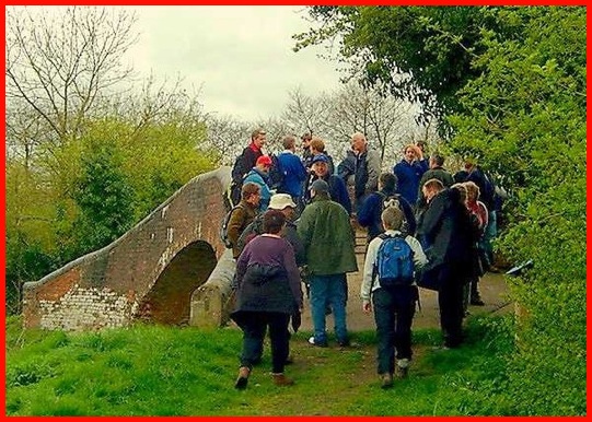 Some of the walkers congregating on the bridge at the link between the Grand Union and Stratford on Avon canals