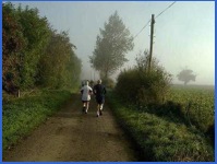 9.22 a.m. - Runners on the 26 mile route passing us and vanishing into the distance .
