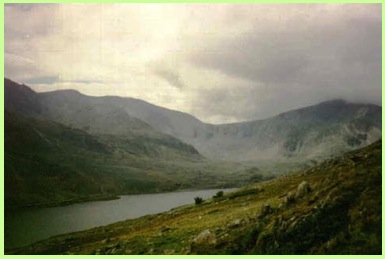 The view from the path up Pen yr Ole Wen looking over Lyn Ogwen towards the Glyders .