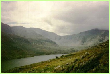 The view from the path up Pen yr Ole Wen looking over Lyn Ogwen towards the Glyders .