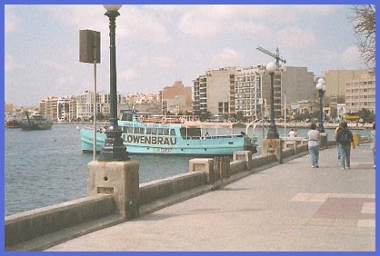 Moored at its berth in Sliema is the ferry, which is a quick and inexpensivee way to get to Valletta and back. In the background is the inevitable crane indicating yet more building work in progress.
