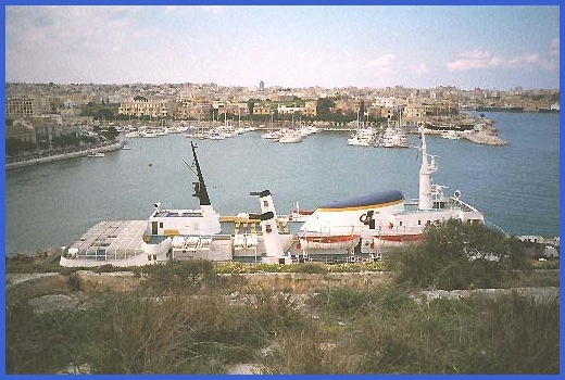 Looking down on the Gozo Ferry from the freesia wall.