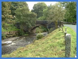 The narrow bridge over the River Dee at the bottom of Arten Gill .