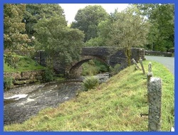 The narrow bridge over the River Dee at the bottom of Arten Gill .