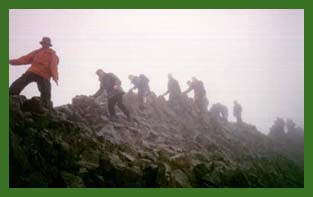 Going across Crib Goch in the rain. Ray and Greg are 4th and 5th from the left respectively.