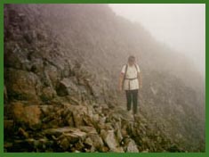 Anne in the mist below the Crib Goch Ridge.