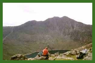 Other walkers taking a break below Crib Goch and admiring Y Lliwedd.
